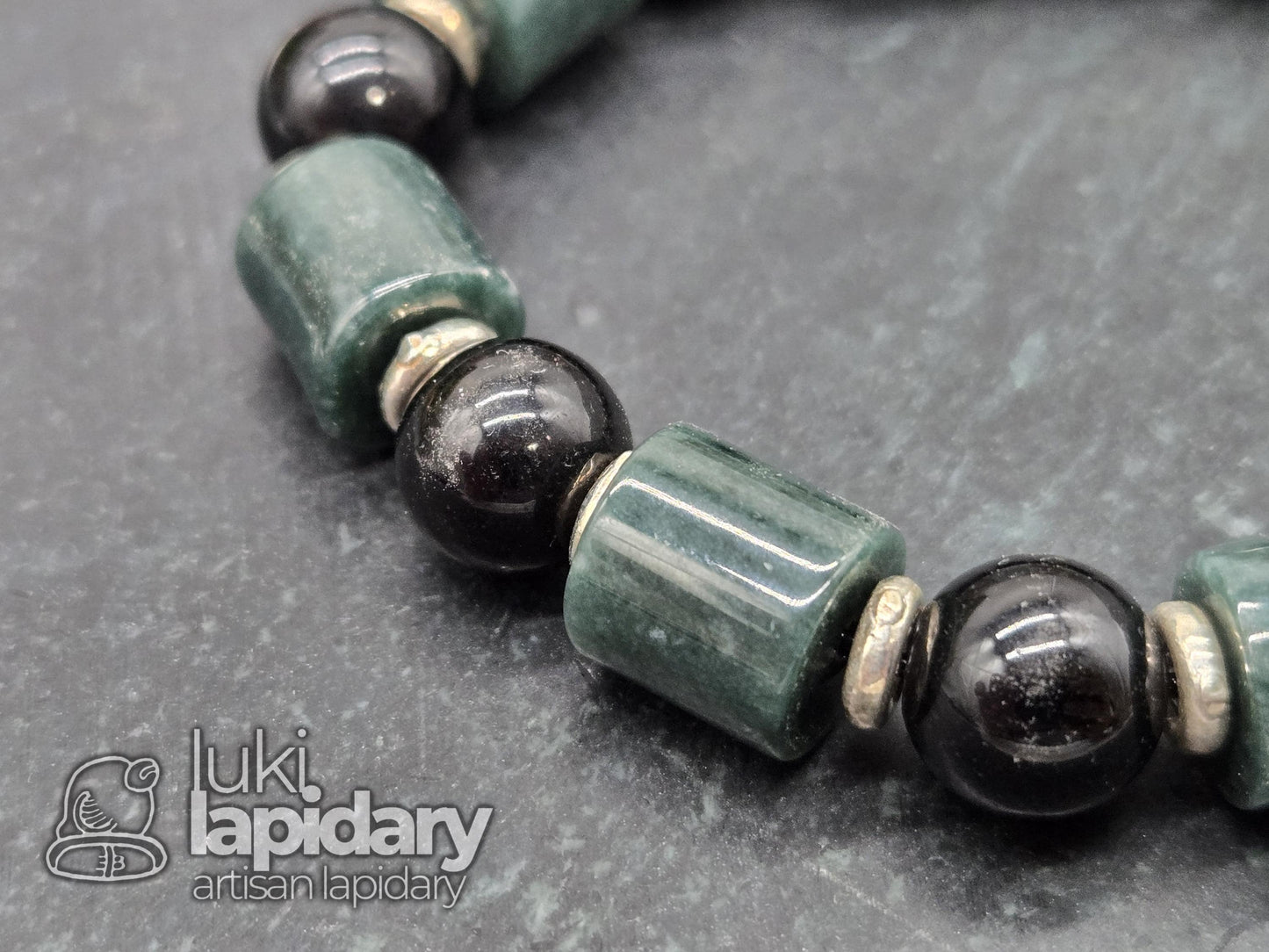 Guatemalan Jadeite Jade Cylinder Bracelet >> 925 Silver Spacers >> 10mm >> 7.5 Inches Stretch >> Hand Made Beads >> Gold Sheen Obsidian