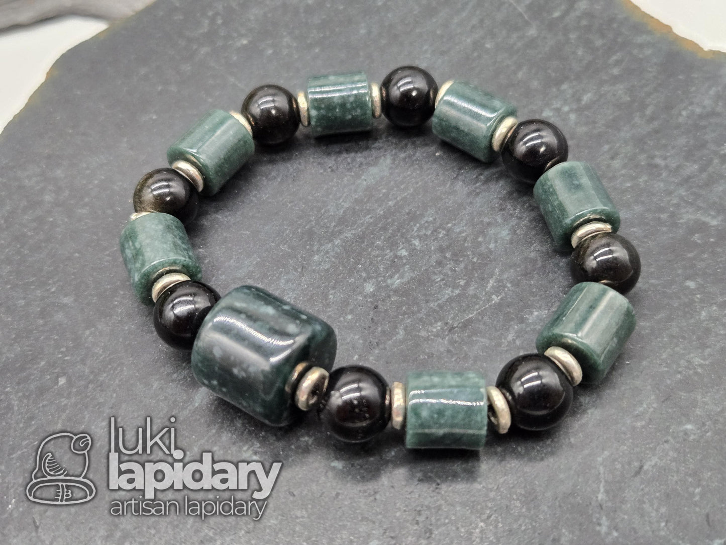 Guatemalan Jadeite Jade Cylinder Bracelet >> 925 Silver Spacers >> 10mm >> 7.5 Inches Stretch >> Hand Made Beads >> Gold Sheen Obsidian