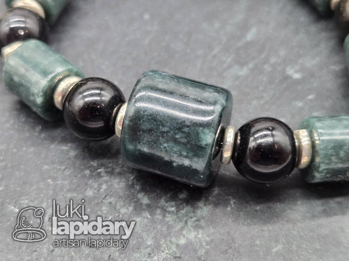 Guatemalan Jadeite Jade Cylinder Bracelet >> 925 Silver Spacers >> 10mm >> 7.5 Inches Stretch >> Hand Made Beads >> Gold Sheen Obsidian