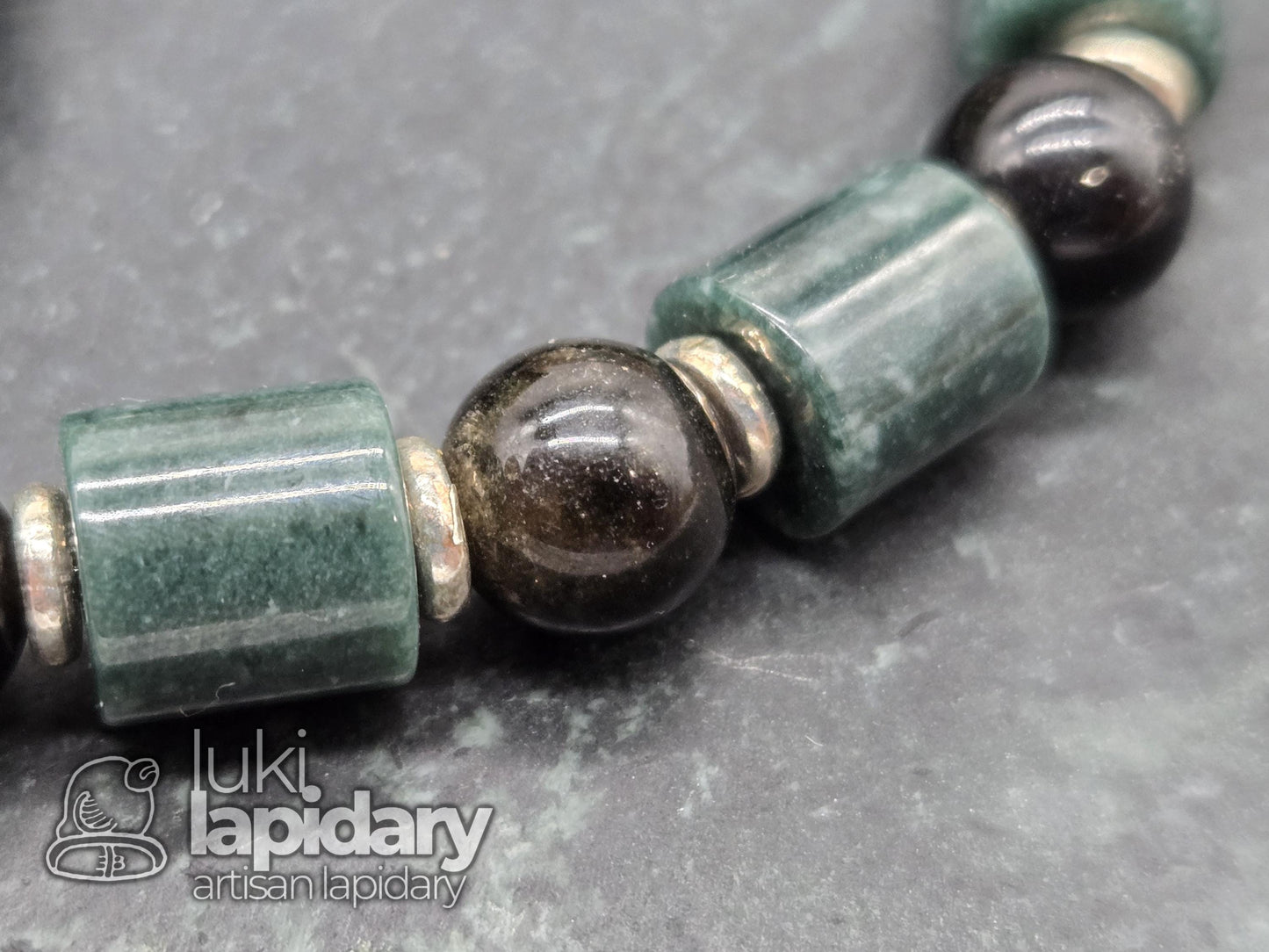 Guatemalan Jadeite Jade Cylinder Bracelet >> 925 Silver Spacers >> 10mm >> 7.5 Inches Stretch >> Hand Made Beads >> Gold Sheen Obsidian